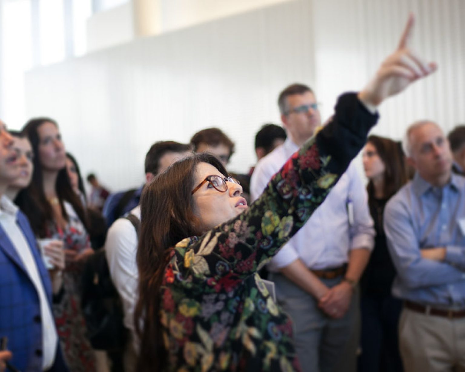 Dr. Andrea Chegut pointing out data to audience during world real estate forum