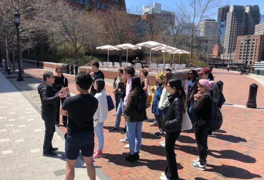 students outside in Boston touring development sites